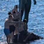 statue neptune melenara touristes comportements irrespectueux